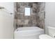Bathroom with a shower/tub combo, tile surround, and modern fixtures at 5272 Riverlake Dr, Bartow, FL 33830