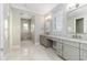 Elegant bathroom with dual vanities, granite countertops, and a walk-in shower at 5272 Riverlake Dr, Bartow, FL 33830