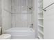 Bathroom with a bathtub, shower, and built-in shelving at 5272 Riverlake Dr, Bartow, FL 33830