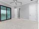 Bright bedroom featuring carpet, doors to balcony, and natural light at 5272 Riverlake Dr, Bartow, FL 33830