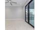 Spacious bedroom with carpeting, sliding glass doors, and water views at 5272 Riverlake Dr, Bartow, FL 33830