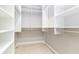 Well-organized closet with custom shelving and rods at 5272 Riverlake Dr, Bartow, FL 33830