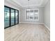 Bright dining room with chandelier, wood-look floors, and sliding doors at 5272 Riverlake Dr, Bartow, FL 33830