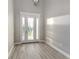Bright entry with hardwood floors and glass door at 5272 Riverlake Dr, Bartow, FL 33830