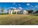 Luxury waterfront home with expansive lawn and modern design at 5272 Riverlake Dr, Bartow, FL 33830