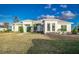 White two-story house with palm trees and walkway at 5272 Riverlake Dr, Bartow, FL 33830