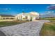Home features a large driveway and partial water view at 5272 Riverlake Dr, Bartow, FL 33830