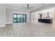 Open living space with tile floors and kitchen view at 5272 Riverlake Dr, Bartow, FL 33830