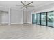 Spacious living area with sliding doors and water views at 5272 Riverlake Dr, Bartow, FL 33830