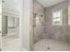 Walk-in shower with tile surround and a built-in seat at 5272 Riverlake Dr, Bartow, FL 33830