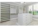 Large walk-in closet with custom shelving and drawers at 5272 Riverlake Dr, Bartow, FL 33830