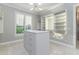 Bright walk-in closet, with custom built-ins and window at 5272 Riverlake Dr, Bartow, FL 33830