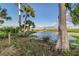 Picturesque waterfront view with pond and lush greenery at 5272 Riverlake Dr, Bartow, FL 33830