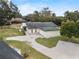 An aerial view of a house with a large yard and a driveway at 6126 Wendel Way, Lakeland, FL 33813