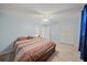 Bright bedroom featuring a ceiling fan and built-in closet at 6126 Wendel Way, Lakeland, FL 33813