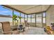 Relaxing screened porch with wicker chairs and backyard view at 616 W Remington Rd, Lakeland, FL 33813