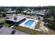 Community pool and shuffleboard courts are featured in this aerial view at 646 Cottage Ln, Lakeland, FL 33803