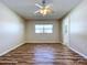 Spacious bedroom featuring wood-look floors and a view at 646 Cottage Ln, Lakeland, FL 33803