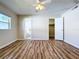 Spacious bedroom with wood-look floors and ensuite bathroom at 646 Cottage Ln, Lakeland, FL 33803