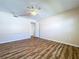 Spacious bedroom with wood-look floors and access to hallway at 646 Cottage Ln, Lakeland, FL 33803