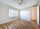 Spacious bedroom with laminate flooring and ceiling fan at 646 Cottage Ln, Lakeland, FL 33803