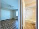 Bright bedroom with ensuite bath, featuring laminate flooring and updated fixtures at 646 Cottage Ln, Lakeland, FL 33803