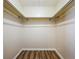 Large walk-in closet with double hanging rods at 646 Cottage Ln, Lakeland, FL 33803