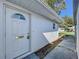 Front door entry with walkway, showing exterior of home at 646 Cottage Ln, Lakeland, FL 33803