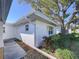 Single story home with walkway and landscaping at 646 Cottage Ln, Lakeland, FL 33803