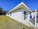 Rear view of home showcasing clean lines and private patio area at 646 Cottage Ln, Lakeland, FL 33803