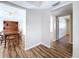View of a hallway with hardwood floors and access to other rooms at 646 Cottage Ln, Lakeland, FL 33803