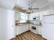 Kitchen with white cabinets, granite countertops, and modern appliances at 646 Cottage Ln, Lakeland, FL 33803