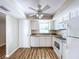 Kitchen with white cabinets, granite countertops, and modern appliances at 646 Cottage Ln, Lakeland, FL 33803