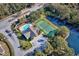 Community features tennis courts, pool, clubhouse, and pond at 6555 Lake Clark Dr, Lakeland, FL 33813