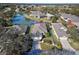 House in a neighborhood setting with a pond in the background at 6555 Lake Clark Dr, Lakeland, FL 33813