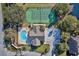 Community features tennis courts, pool, clubhouse, and pond at 6555 Lake Clark Dr, Lakeland, FL 33813