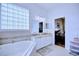 Bathroom features a large soaking tub and double vanity at 6555 Lake Clark Dr, Lakeland, FL 33813