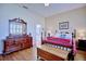 Main bedroom with hardwood floors and large dresser at 6555 Lake Clark Dr, Lakeland, FL 33813