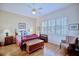 Spacious bedroom with hardwood floors and a ceiling fan at 6555 Lake Clark Dr, Lakeland, FL 33813