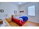Cozy bedroom with hardwood floors, a double bed, and ample closet space at 6555 Lake Clark Dr, Lakeland, FL 33813