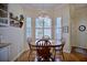 Charming breakfast nook with wood table and chairs, near a bright window at 6555 Lake Clark Dr, Lakeland, FL 33813