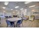 Community clubhouse with tables, chairs, and a comfy couch at 6555 Lake Clark Dr, Lakeland, FL 33813