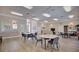 Clubhouse with multiple tables, chairs, and a relaxing sitting area at 6555 Lake Clark Dr, Lakeland, FL 33813