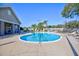 Relaxing kidney-shaped pool and spa with plenty of lounge chairs at 6555 Lake Clark Dr, Lakeland, FL 33813