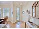 Bright entryway with hardwood floors, a decorative door, and a console table at 6555 Lake Clark Dr, Lakeland, FL 33813