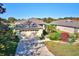 Well-manicured home featuring an attached garage and attractive landscaping at 6555 Lake Clark Dr, Lakeland, FL 33813