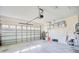 Garage with automatic door opener and shelving for storage at 6555 Lake Clark Dr, Lakeland, FL 33813