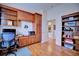 Bright home office with built-in wooden desk, cabinets, and bookshelves at 6555 Lake Clark Dr, Lakeland, FL 33813