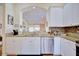 Kitchen with white cabinets, granite countertops, and stainless steel appliances at 6555 Lake Clark Dr, Lakeland, FL 33813