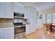 Bright kitchen with stainless steel appliances and granite countertops at 6555 Lake Clark Dr, Lakeland, FL 33813